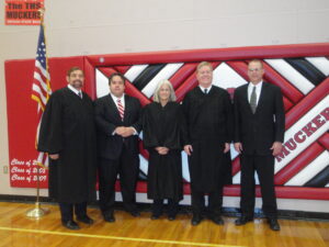 Chief Justice Michael Cherry, Attorney Christopher Arabia, Justice Kristina Pickering, Justice Mark Gibbons, and Attorney John Friel